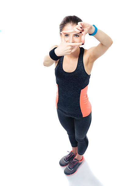 istock Sporty young woman making frame with fingers 478117184