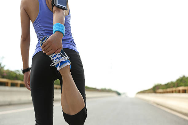 istock young woman runner warm up outdoor 478117730