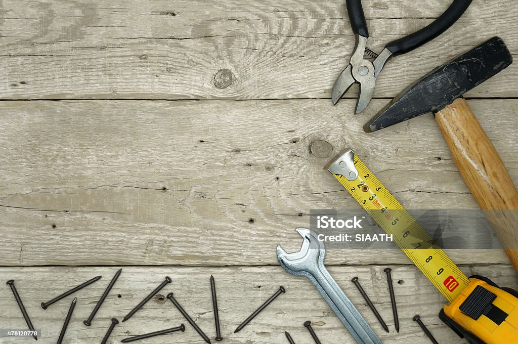 Handyman Equipment Handyman Tools and Nails on a Wooden Table Black Color Stock Photo