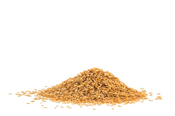 istock Pile of golden flax seed or linseed isolated on white 478121144