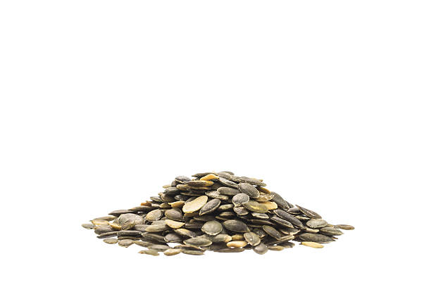 istock Pile of pumpkin seeds isolated on white background 478121156