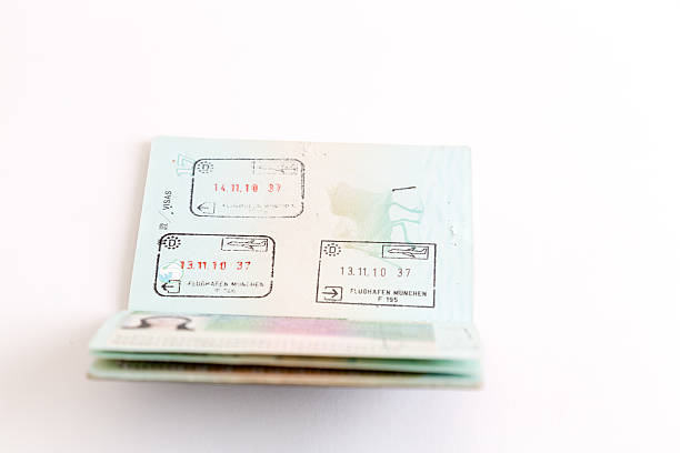 istock Visas and stamps in passport 478124910