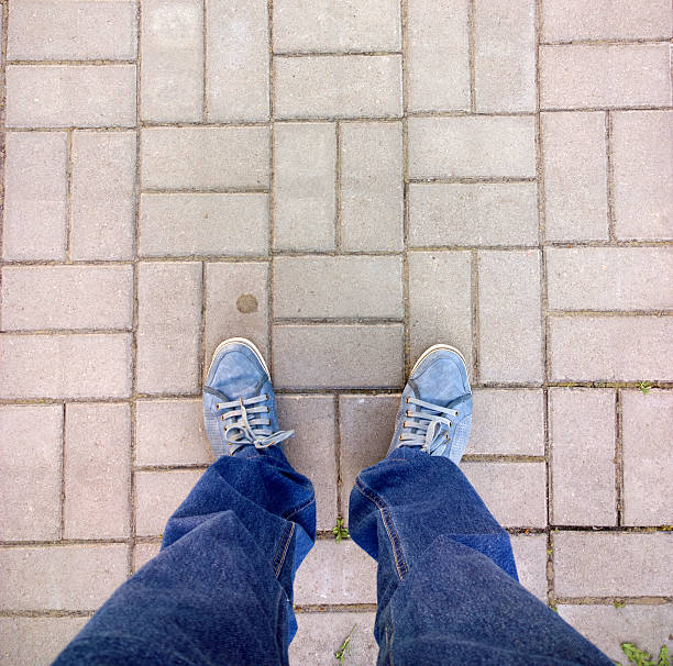 istock Feet on the cobblestone. 478125300