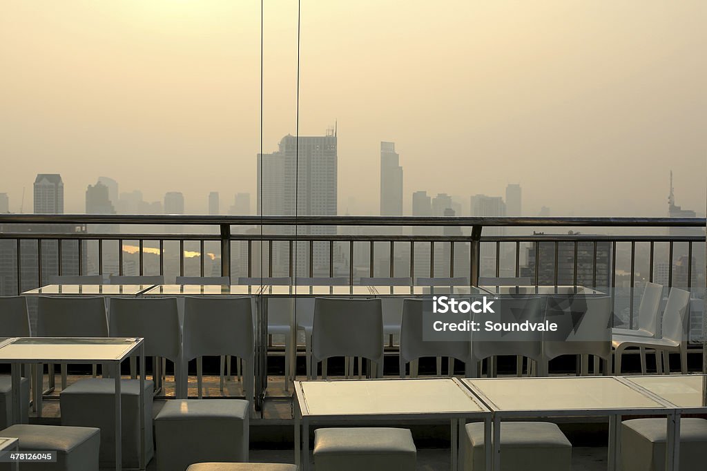 Smoggy sky bar view at dawn Smoggy sky of Bangkok from one of the sky bars Bar - Drink Establishment Stock Photo