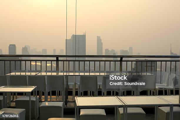 Smoggy Sky Bar View At Dawn Stock Photo - Download Image Now - Bar - Drink Establishment, Chair, Cloud - Sky