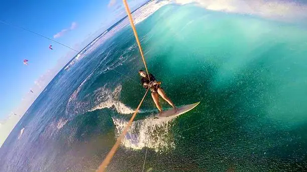 A girl kitesurfing with the camera mounted on the kite lines.  Shot in Hawaii on the North Shore of Oahu.