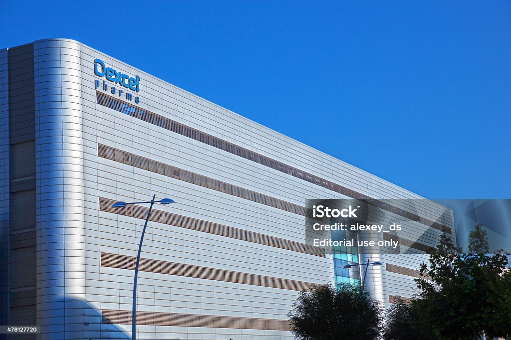 Dexcel Pharma plans Yokneam Illit , Israel - May 17, 2015:Building of Dexcel Pharma plant. Dexcel Pharma is a private international pharmaceutical company, involved in all stages of the pharmaceutical process: the 2nd largest Israeli pharmaceutical manufacturer, supplying 25% of the branded and generic pharmaceuticals sold in Israel. Manufacturing Stock Photo