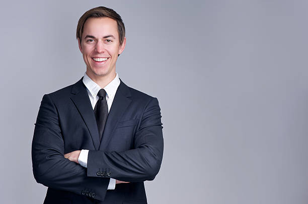 istock Business man smiling with arms crossed 478127967