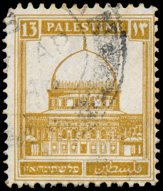istock Stamp printed in Palestine shows building 478130411