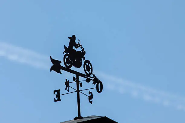 weathervane shaped bike on trail in the sky