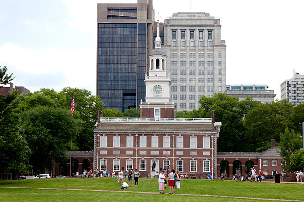 Independence Hall in Philadelphia Philadelphia, Pennsylvania, USA - June 14, 2015: Tourist sightseeing in   front of one of Amarica's most famous landmark, Independence Hall in Philadelphia, Pennsylvania independence hall stock pictures, royalty-free photos & images