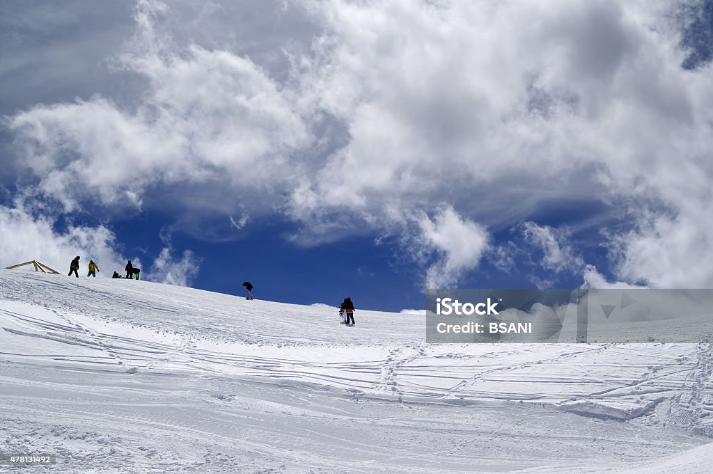 Ski slope in sun wind day Ski slope in sun wind day. Caucasus Mountains, ski resort Dombay. Ski Stock Photo