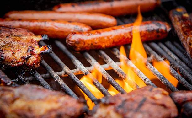 istock hot dogs and ribs on a grill 478131590