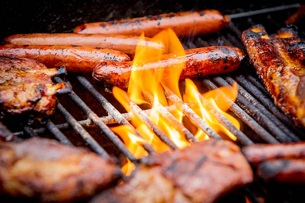 istock hot dogs and ribs on a grill 478134524
