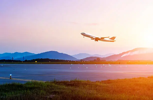 Photo of passenger plane fly up over take-off runway