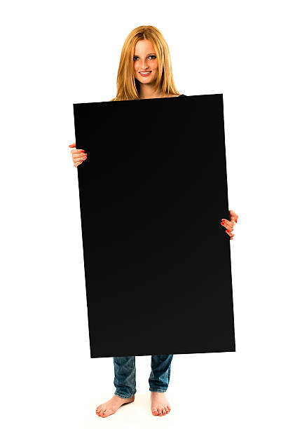 istock pretty young woman holding a black banner 478134638