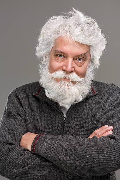 istock Portrait of smiling senior man with white beard 478137720