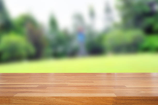 istock Empty wooden table and green nature background 478140846