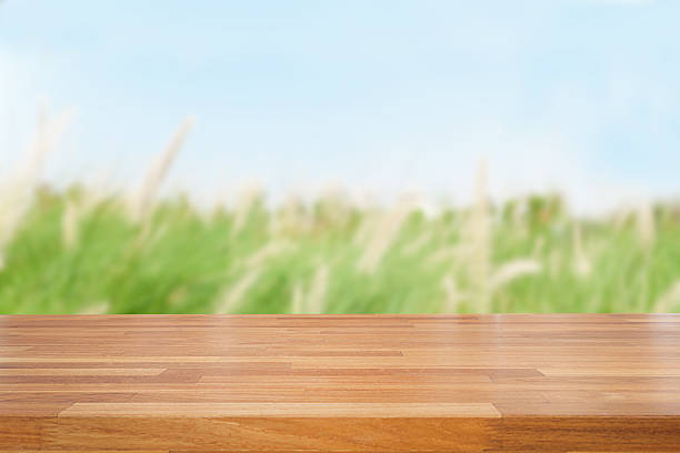 istock Empty wooden table and green nature background 478140848