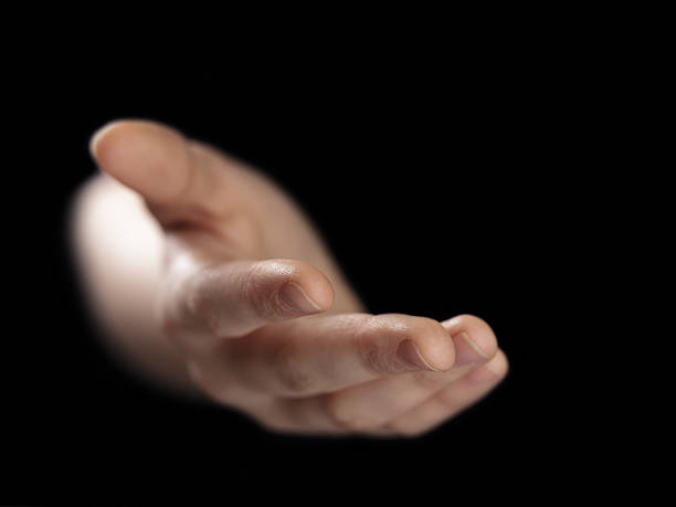 istock female helping hand from darkness 478141259