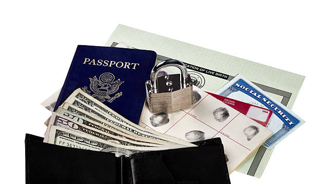 Locked Identity Documents Passport, fingerprint card, driver's license, social security card and birth certificate isolated on white with locked padlock social security social security card identity us currency stock pictures, royalty-free photos & images