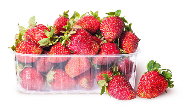 istock Freshly strawberries in a plastic tray and two near 478142146