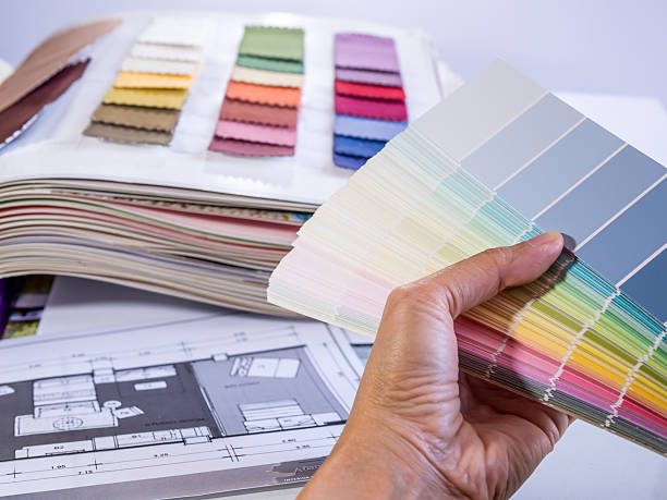 istock Hand holding color samples with interior furniture plan 478142513