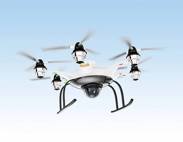 Hexacopter drone with security camera hovering in the sky.