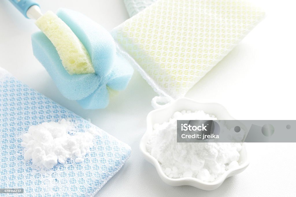 Sodium bicarbonate and sponge On white background Baking Soda Stock Photo