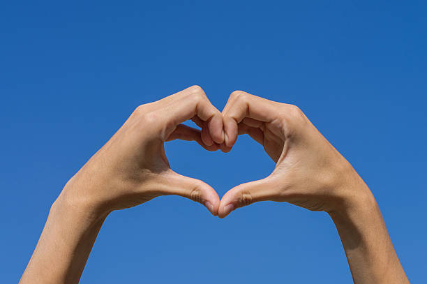 istock hands forming be heart for love with blue sky 478146779