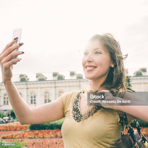 Cheerful Woman Taking A Selfie Alexander Garden Moscow Russia Stock Photo - Download Image Now