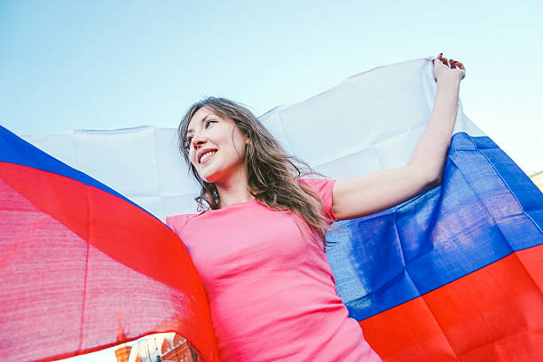 istock Cheering Woman Under Russian Flag 478148720