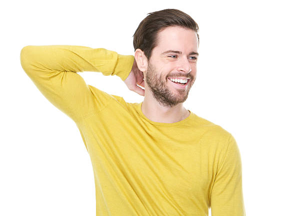 istock young man smiling with hand in hair 478150739