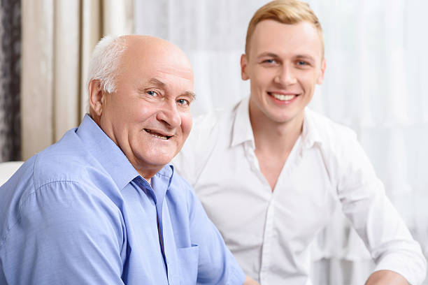 istock Two smiling men of different ages 478154568