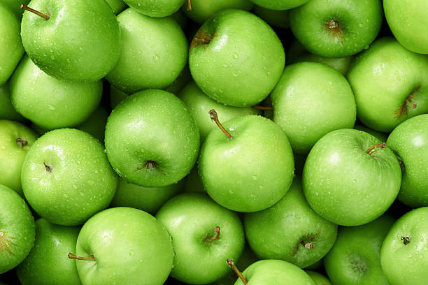 Apple background Green apple Raw fruit and vegetable backgrounds overhead perspective, part of a set collection of healthy organic fresh produce green color stock pictures, royalty-free photos & images