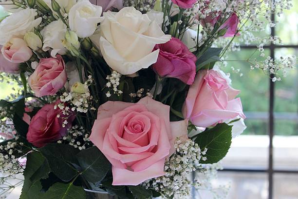 istock Pink and White Rose Bouquet in Front of a Window 478159050