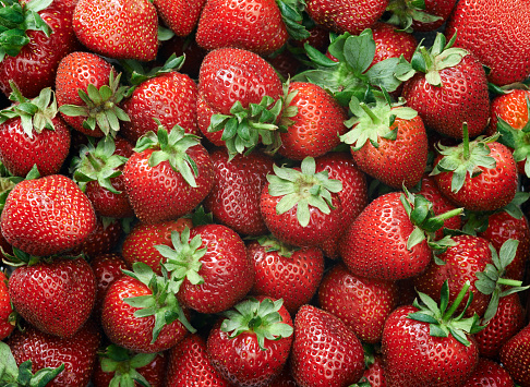 Strawberry raw fruit and vegetable backgrounds overhead perspective, part of a set collection of healthy organic fresh produce