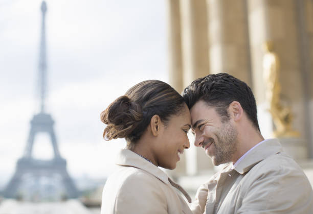 abstract background : silhouette of romantic lovers with eiffel tower in Paris with sunset