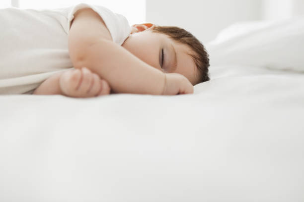 istock Baby girl sleeping on bed 478167537