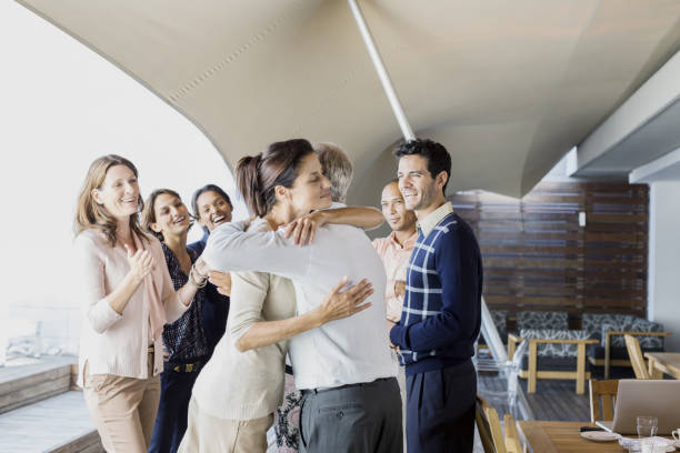 istock Business people hugging in office 478168011
