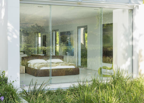 istock Grass outside window of modern bedroom 478168355