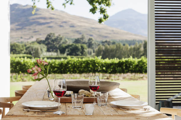 istock Dining table and chairs on luxury patio overlooking vineyard 478168437