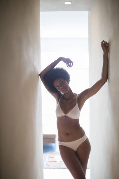 istock Woman wearing bra and panties in corridor 478168521