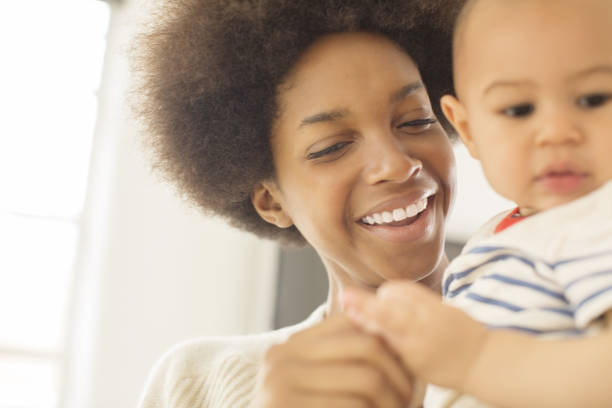 istock Mother holding baby boy 478168549