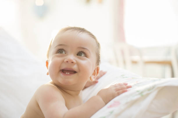 istock Baby boy smiling on bed 478168983