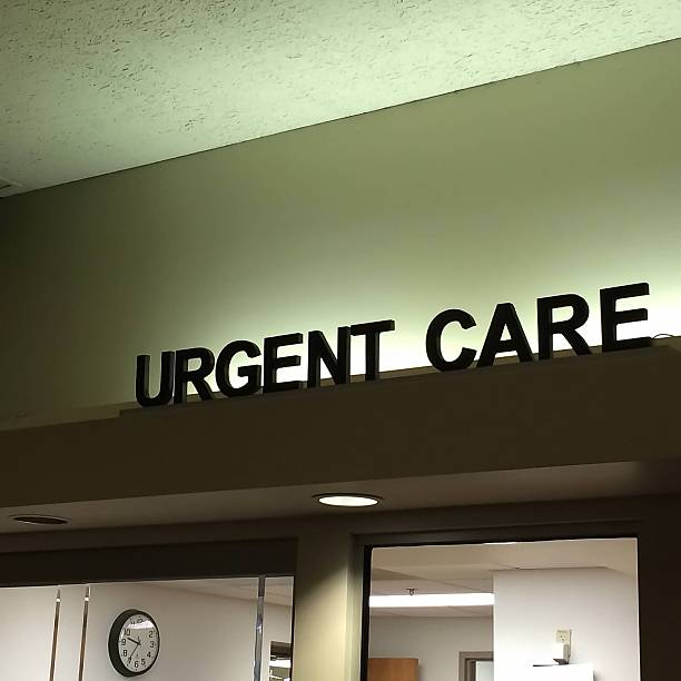 Urgent Care Urgent Care Sign with Clock below in Anticipation of the next patient emergency medicine stock pictures, royalty-free photos & images