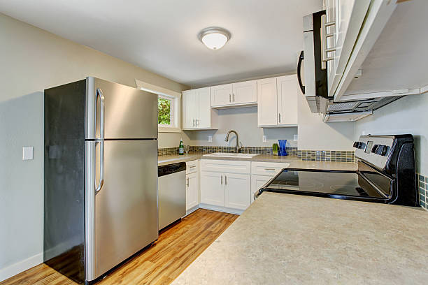 istock Furnished kitchen room with white cabinets and steel appliances 478169076