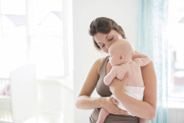 istock Mother holding baby girl 478169105