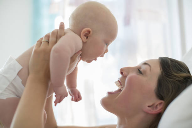 istock Mother playing with baby girl 478169125