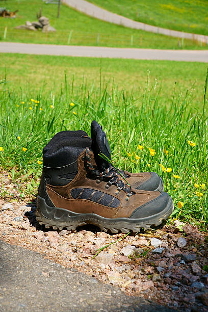 istock Hiking boots stand on the wayside 478169224